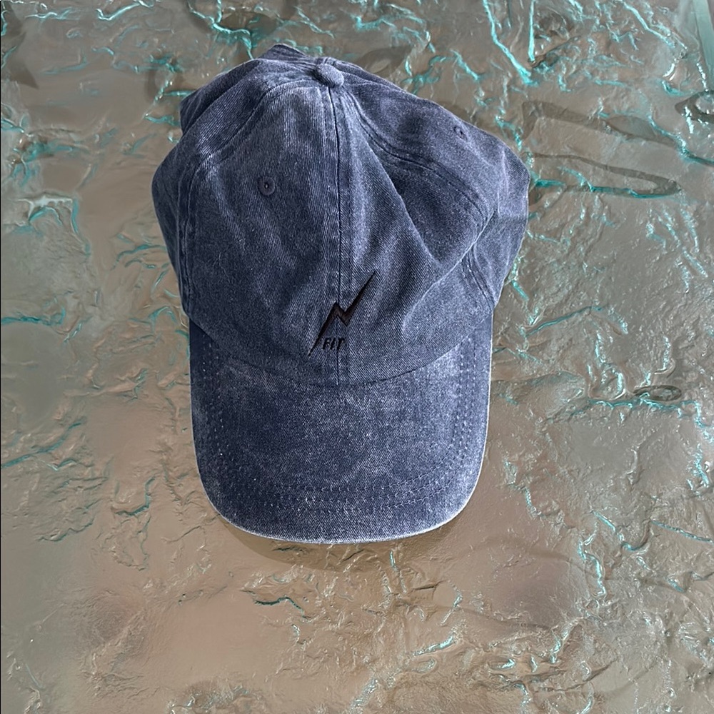 “Dad hat”
Adjustable - denim like - blue hat - with black embroidered fit